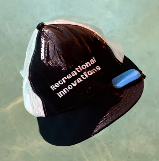 Recreational Innovations hat using the Billbobber hat float. Billbobber floating hat clip.