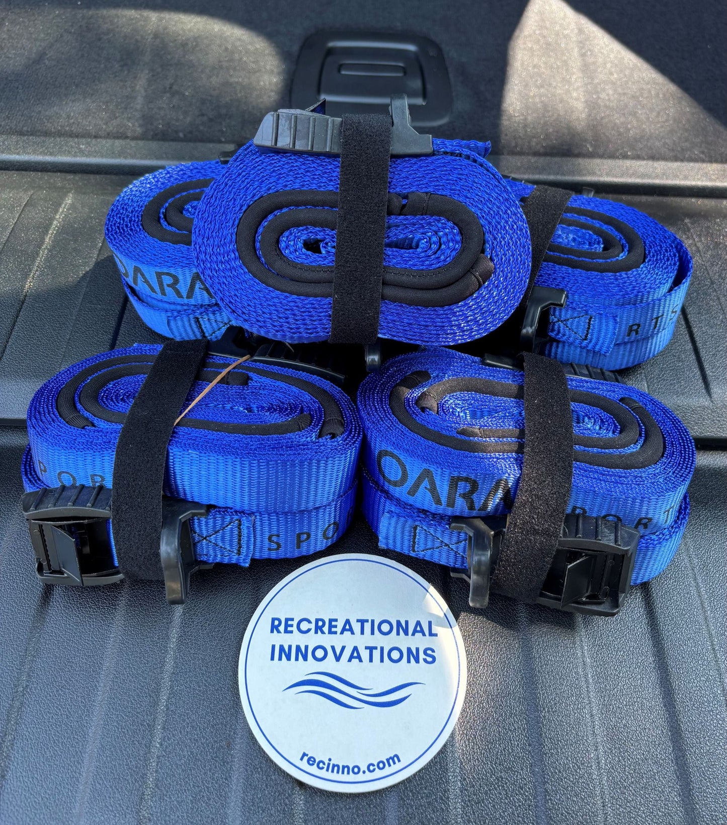 Oara Sports Cam Straps on X5 trunk tailgate. Tie down a kayak on a BMW X5. Protect your car's paint.