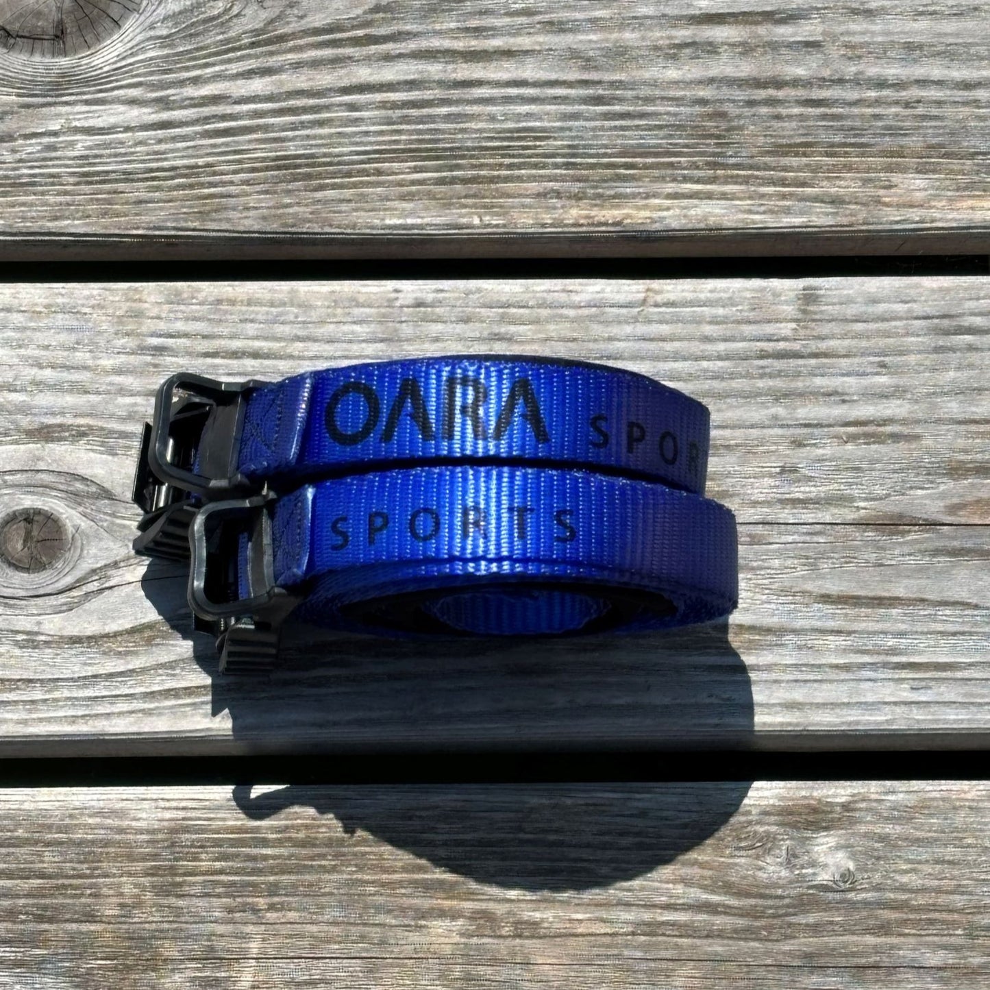 Protective Cam Strap set sitting on the dock. Order from Recreational Innovations.