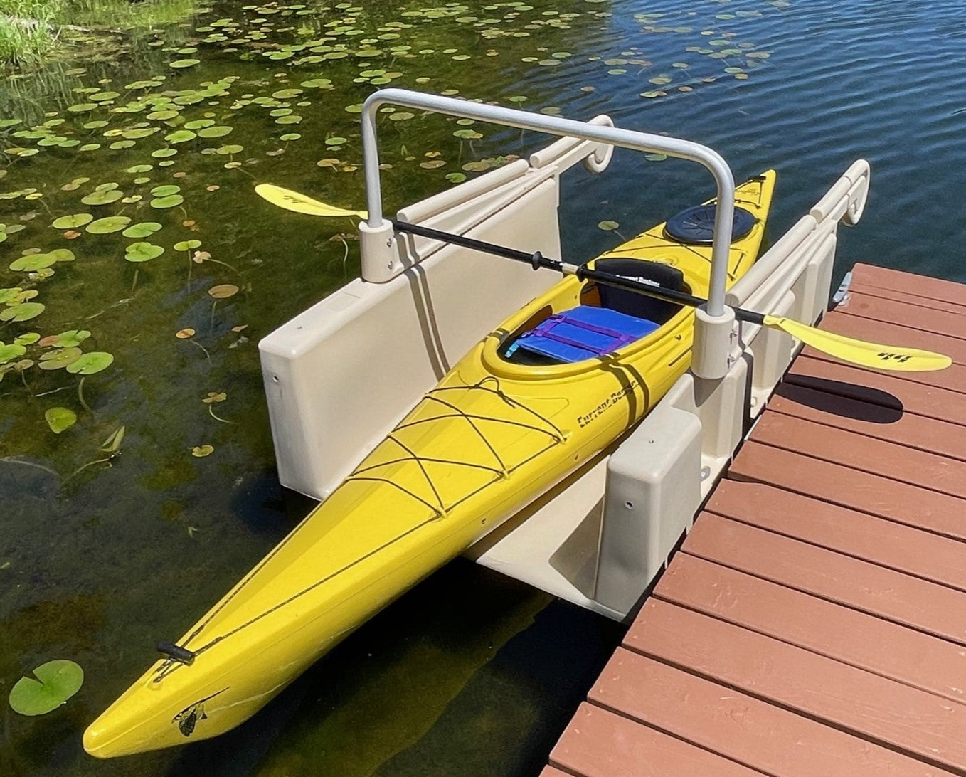 Tan YAKport kayak launch kit premium package setup with a floating dock installation kit which is an optional installation kit with the premium package. Installed in Waupaca, Wisconsin. Kayak launch.