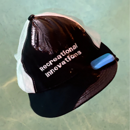 Recreational Innovations hat with a Billbobber floating hat clip attached to it. Billbobber hat float.